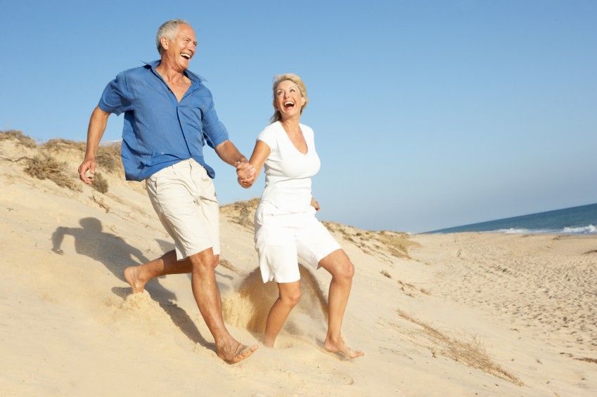 What Insurance Cover Testosterone Middle-Aged Couple Running On the Beach